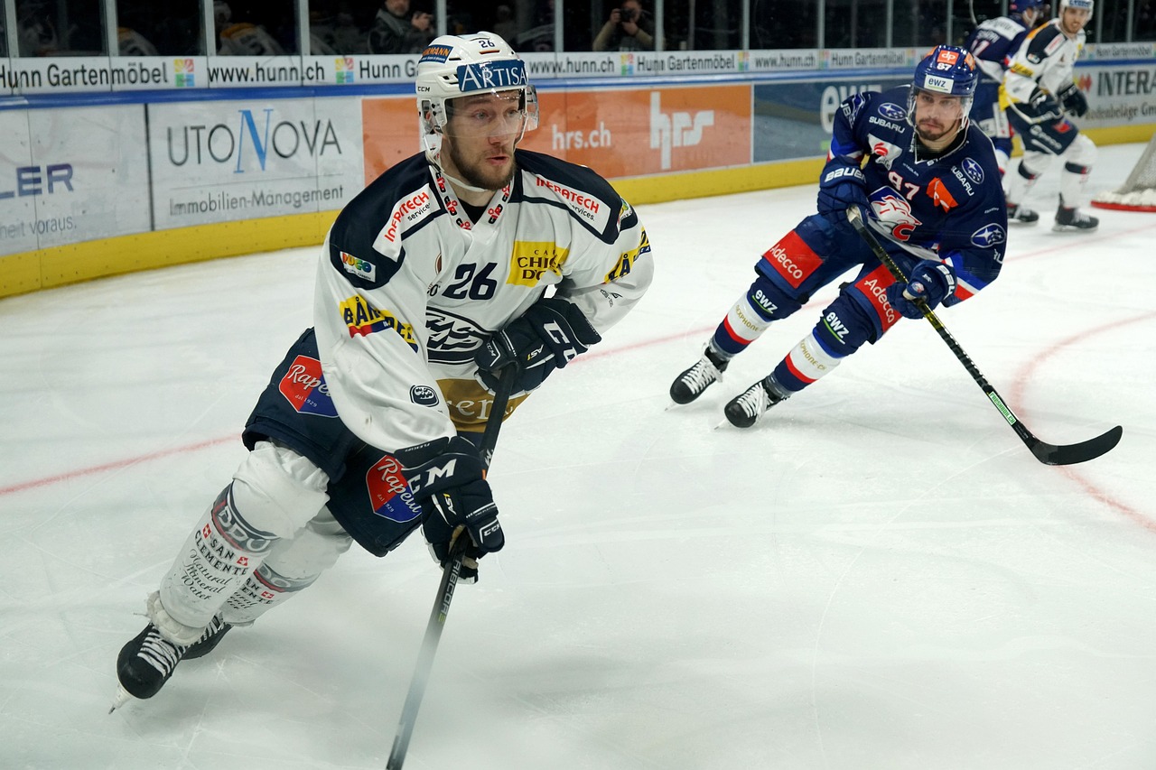 Ice hockey players competing actively during a professional game on ice